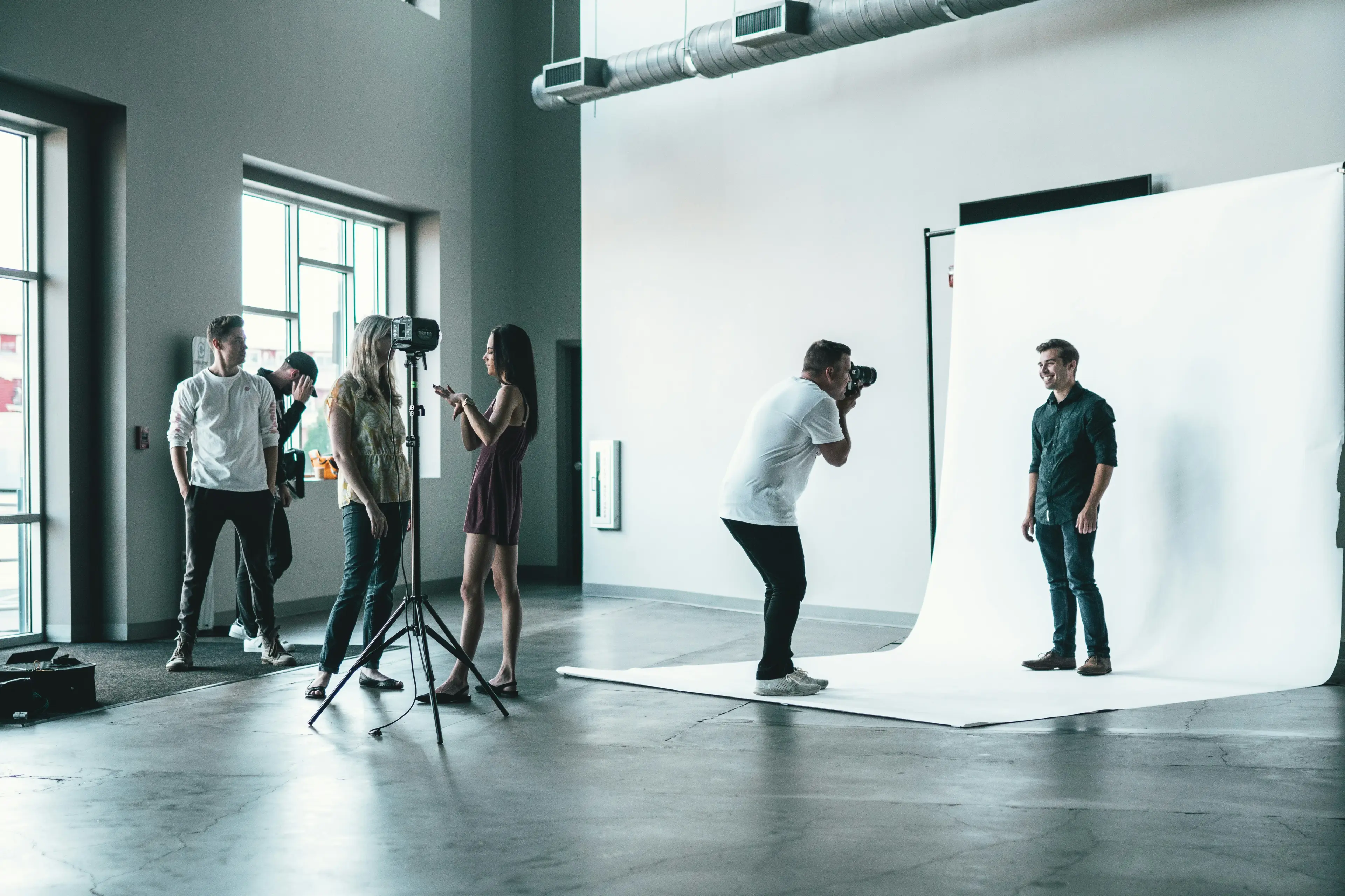 Photographer sharing photos with a happy client